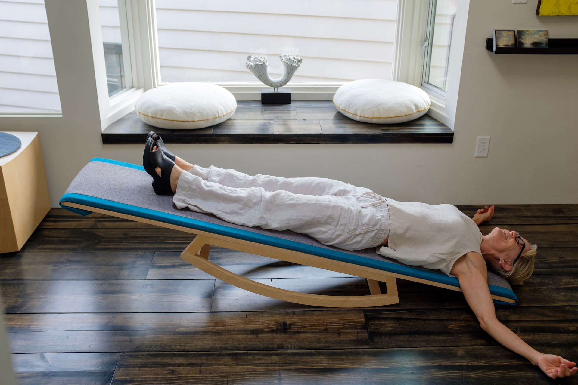 Woman outstretched on the Lull Gentle Inversion Board